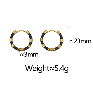 Detail view of bamboo-style gold and black enamel hoop earrings with size specifications