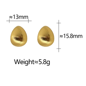 Detail view of gold drop earrings showing 13x15.8mm size and brushed metal texture