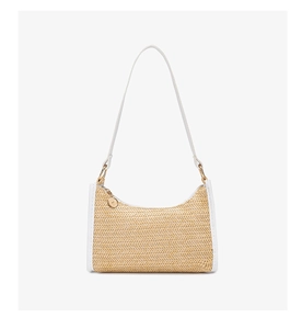Close-up of woven beige straw texture and white leather trim on shoulder bag
