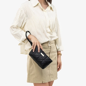 Chic black quilted handbag for women featuring a logo plaque and wristlet strap