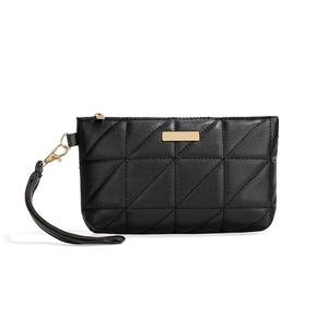 Chic black quilted leather mini handbag with gold metal plate and wrist strap
