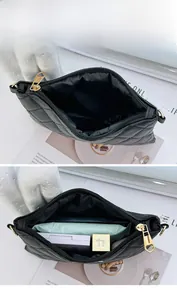 Close-up of black quilted PU leather pouch showing large interior capacity with gold zipper