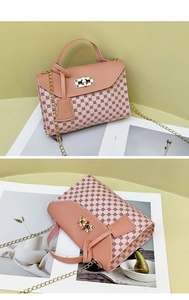 Close-up of pink and brown monogram small square bag with golden chain and metallic lock
