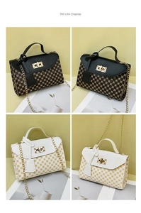 Detailed view of elegant square handbags with gold patterns and metallic chain straps