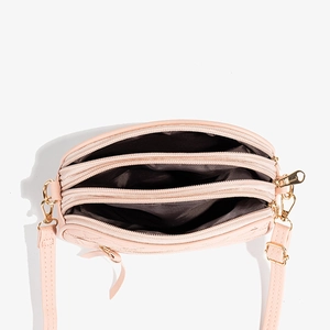 Three-zipper pink quilted camera bag showing spacious compartments and brown lining