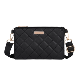 Chic black quilted shoulder bag with gold hardware and adjustable strap on white background