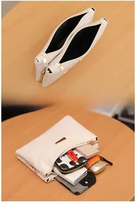 Internal view showing dual compartments of the beige quilted crossbody bag with daily items