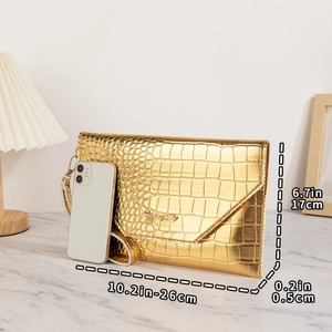 Golden crocodile embossed envelope clutch bag shown with mobile phone for size reference