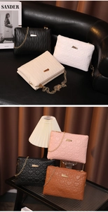 Detailed view of quilted faux leather crossbody bags with heart patterns and gold chains