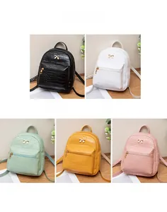 Mini crocodile pattern backpacks in black white green yellow and pink with gold bow charm