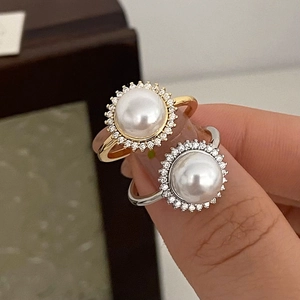 Lustrous round pearl ring with pavé zircon sunflower halo in gold and silver finish