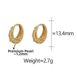 Detail view of pearl gold hoop earrings with dimensions 13.4mm height and 2.7g weight