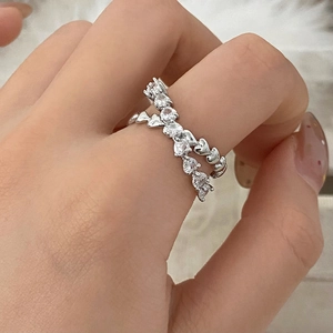 Elegant double-layer heart ring with sparkling zircons worn on a model's finger