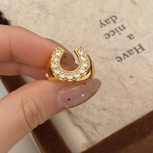 Minimalist horseshoe ring with sparkling cubic zirconia on gold plated open band