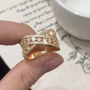 Sparkling gold-plated crossover layered ring with micro-paved cubic zirconia accents