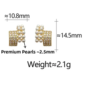 Detail of French style C-shape stud earrings with pearls, zircons and gold finish
