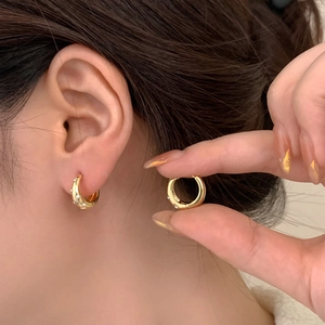 Elegant gold hoop earrings with zircon stones in a minimalist chic design for women