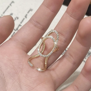Gold plated micro-pasted zircon nail ring with hollow double oval design on vintage paper