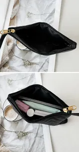 Interior view of black quilted long wallet showing large capacity for phone and cosmetics