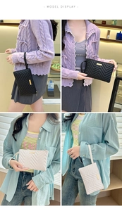 Detail of V-quilted faux leather clutches with gold hardware and wrist straps for women