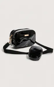 Glossy black PU leather crossbody bag with matching round coin purse and gold hardware