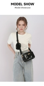 Glossy black PU leather crossbody bag with wide strap and round coin purse detail