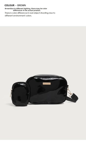 Detail of glossy PU leather crossbody bag with a mini purse and wide woven strap