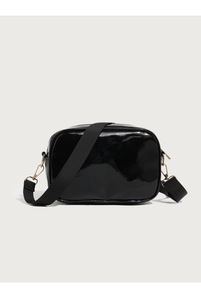 Close-up of glossy black PU leather bag with wide strap and gold metal hardware