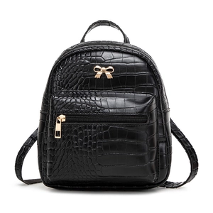 Mini black crocodile embossed backpack with golden bow detail and top handle for women