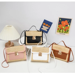 Detailed view of woven crossbody bags in four colors with gold metal buckles and flap