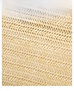 Detailed macro view of beige woven texture and pattern on this stylish crossbody bag