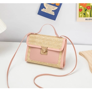 Detail of pink and natural woven mini bag with gold heart lock and thin strap