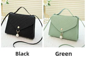 Close-up of V-weave texture on black and green crossbody bags with pearl charms