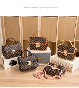 Detailed shot of retro monogram patterns and metal clasps on five elegant color options