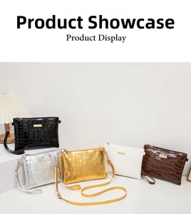 Detailansicht der hochwertigen Krokoprägung und Goldmetallelemente an eleganten Handtaschen