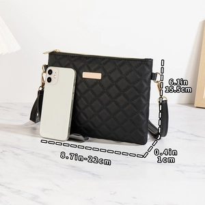 Size guide for black quilted crossbody bag showing dimensions 22cm by 15.5cm with phone scale