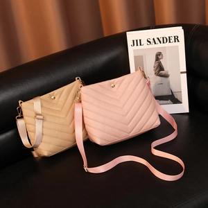 Chic V-quilted faux leather bucket bags in beige and pink with wide fabric straps