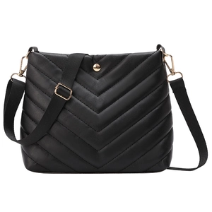 Quilted black PU leather bucket bag with V-shaped stitching and golden hardware detail