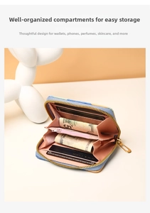Detail of blue patterned wallet with pink leather interior showing card slots and compartments
