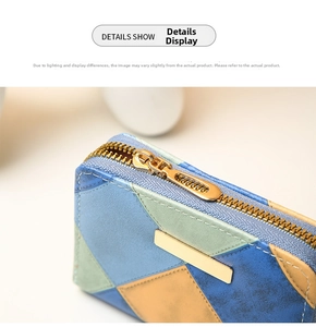 Detail of color-block PU leather wallet featuring gold zipper and textured surface