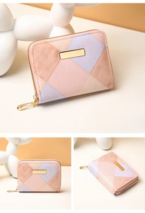 Detail view of a tri-color quilted patchwork mini wallet with golden metal clasp hardware