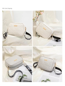 Detalle del bolso bandolera acolchado crema con costuras en V y correa ancha tejida