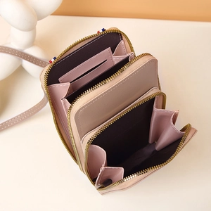 Sac bandoulière rose pour téléphone avec trois compartiments zippés et porte-cartes