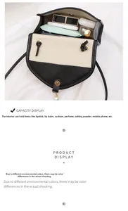 Detail view showing internal storage for phone and perfume in black and white woven bag