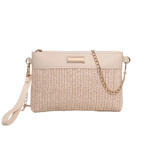 Chic woven straw crossbody bag with gold chain strap and envelope flap on white background