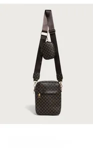 Detail of vintage brown shoulder bag with circular pattern and small round coin purse