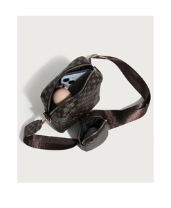 Detail of retro brown crossbody bag interior showing space for phone and small items