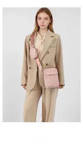 Detailed view of pink monogram crossbody bag set with detachable round mini purse pouch
