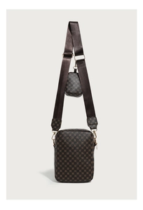 Detail of vintage brown monogram shoulder bag with detachable round coin purse and gold hardware