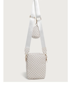 Macro detail of white shoulder bag with monogram pattern and small coin purse on wide strap